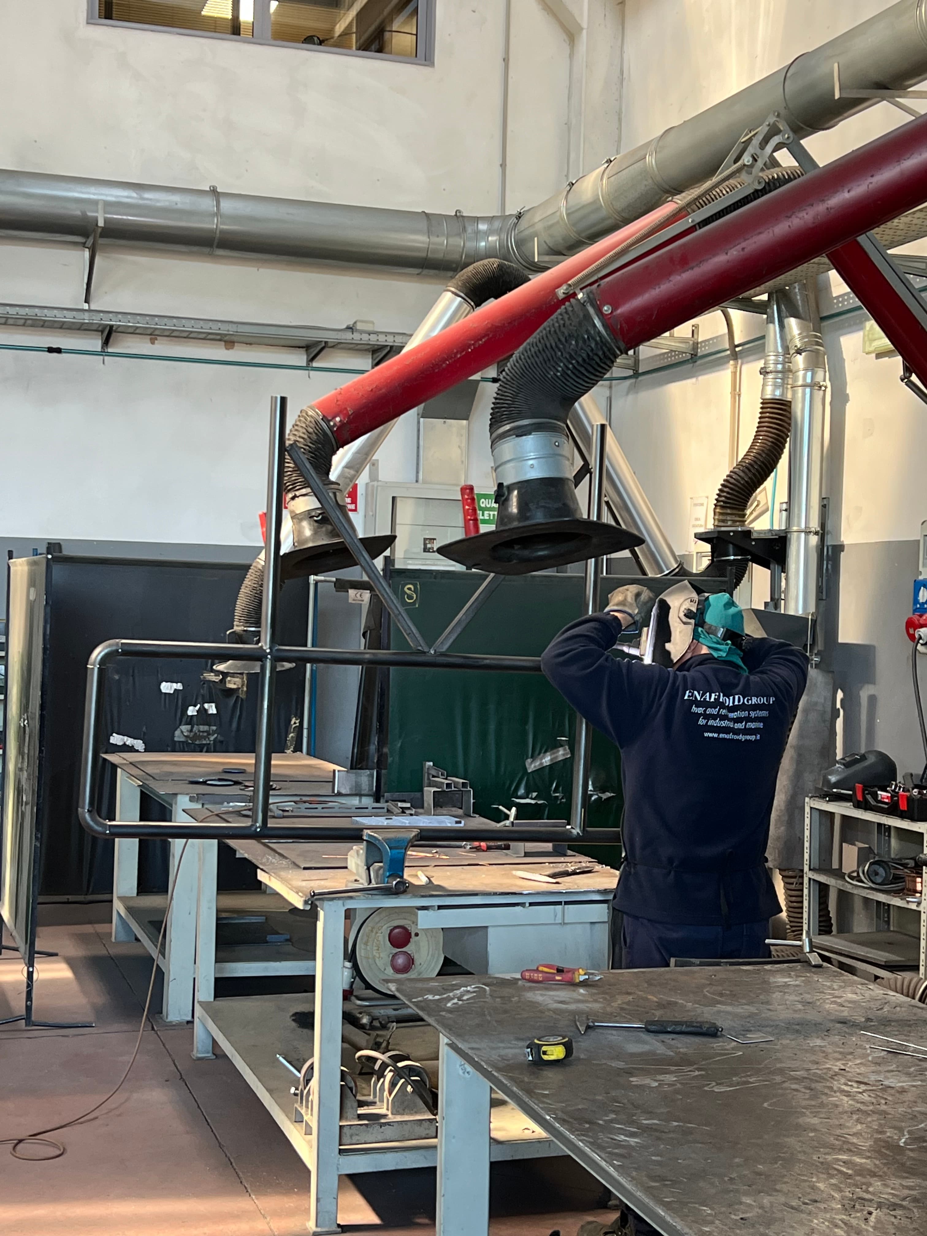 Welder at the bench with fume extraction