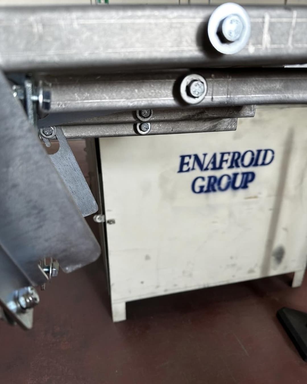 Galvanised steel component with the Enafroid Group logo