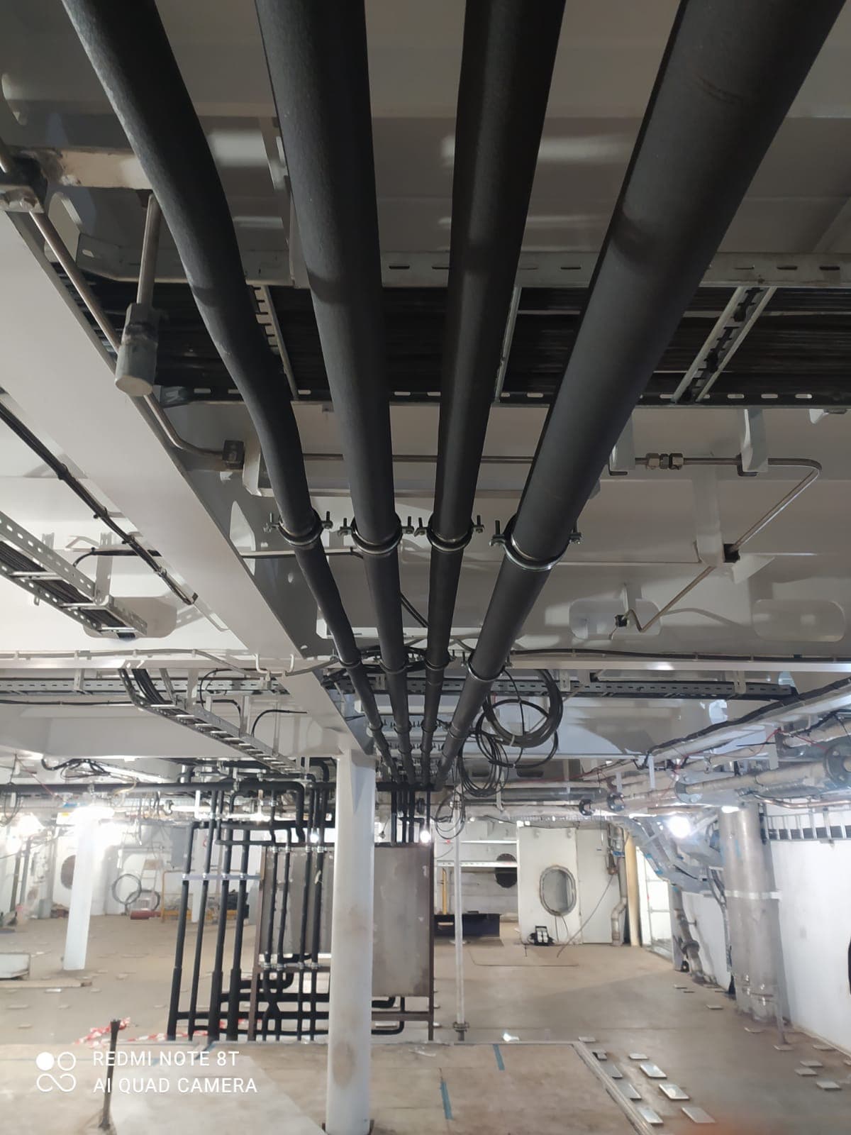 Insulated piping at ceiling level