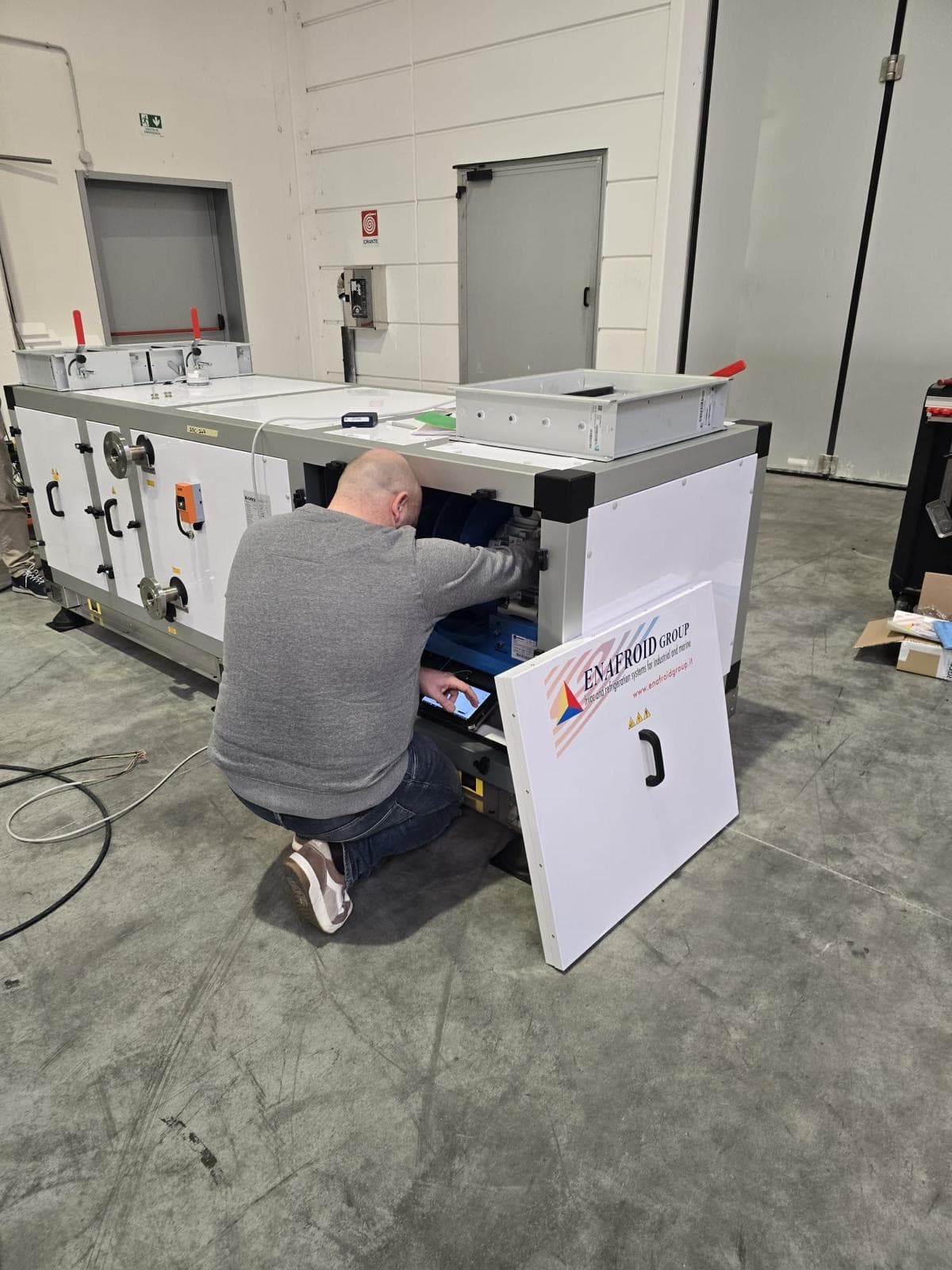 Technician working on an air handling unit
